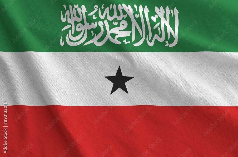 Somaliland flag depicted on folded wavy fabric of old cloth close up Somaliland flag depicted on folded wavy fabric of old cloth close up