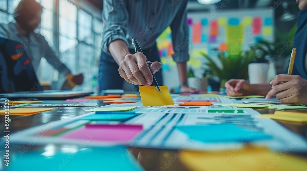 Business team planning a new strategy with colorful sticky notes Business team planning a new strategy with colorful sticky notes