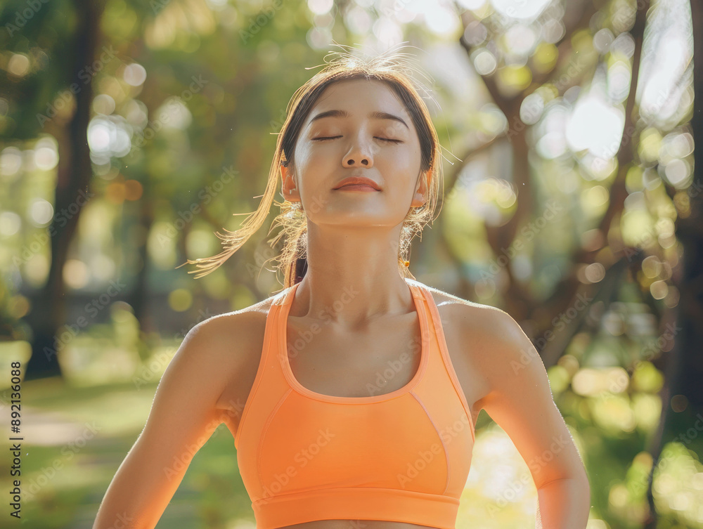 Female jogger. Fit young Asian woman with orange sportswear stretching muscle in park before running and enjoying a healthy outdoor. Fitness runner girl in public park. Wellness being concept Female jogger. Fit young Asian woman with orange sportswear stretching muscle in park before running and enjoying a healthy outdoor. Fitness runner girl in public park. Wellness being concept