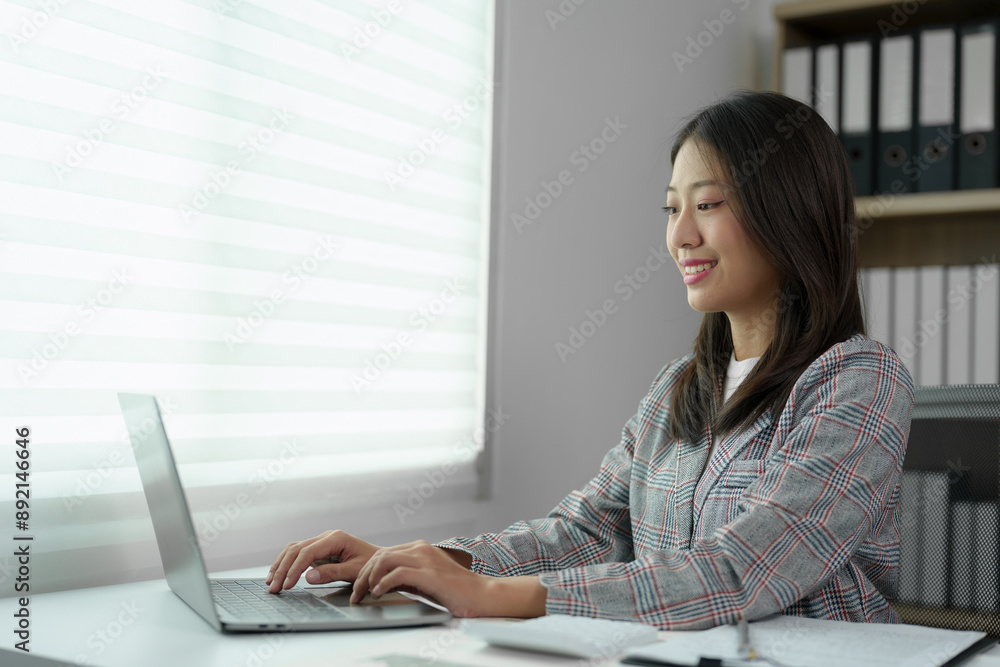 Beautiful business Asian woman working with laptop computer at desk small business owner online freelance worker Online marketing concepts, accounting, e-commerce. Beautiful business Asian woman working with laptop computer at desk small business owner online freelance worker Online marketing concepts, accounting, e-commerce.
