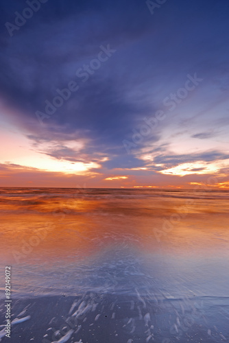 Wallpaper Mural Sunset, water or sky with landscape of beach for travel location, holiday or vacation in Denmark. Clouds, waves or sunrise with background of natural environment with sea shore for tropical adventure Torontodigital.ca