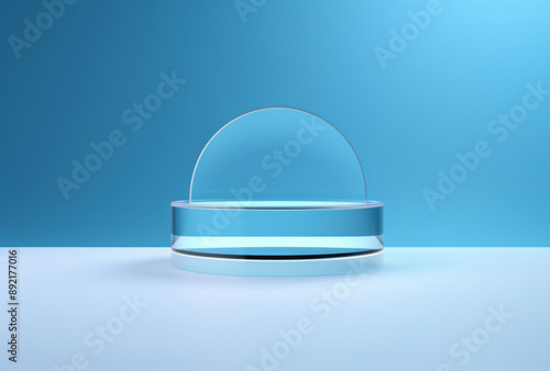 An object sits on a blue background, its minimalist stage designs, glass material, and circular shapes apparent.