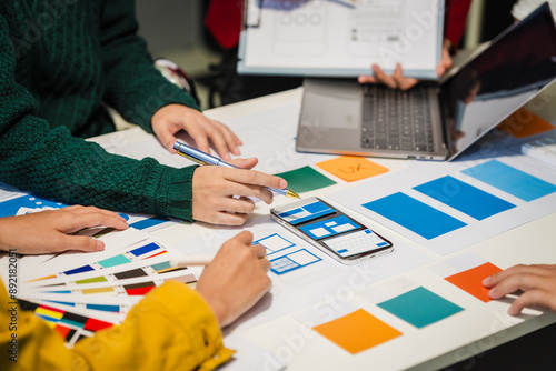 Photography Close-up of hands working on UX/UI design at a desk