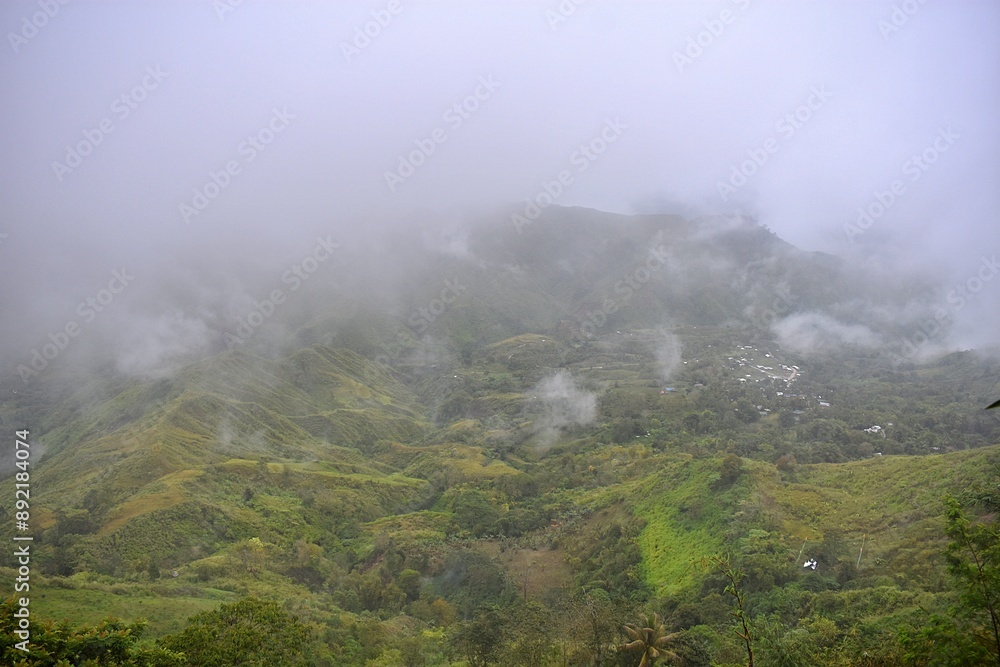 Misty fog weaves through rugged peaks. Misty fog weaves through rugged peaks.