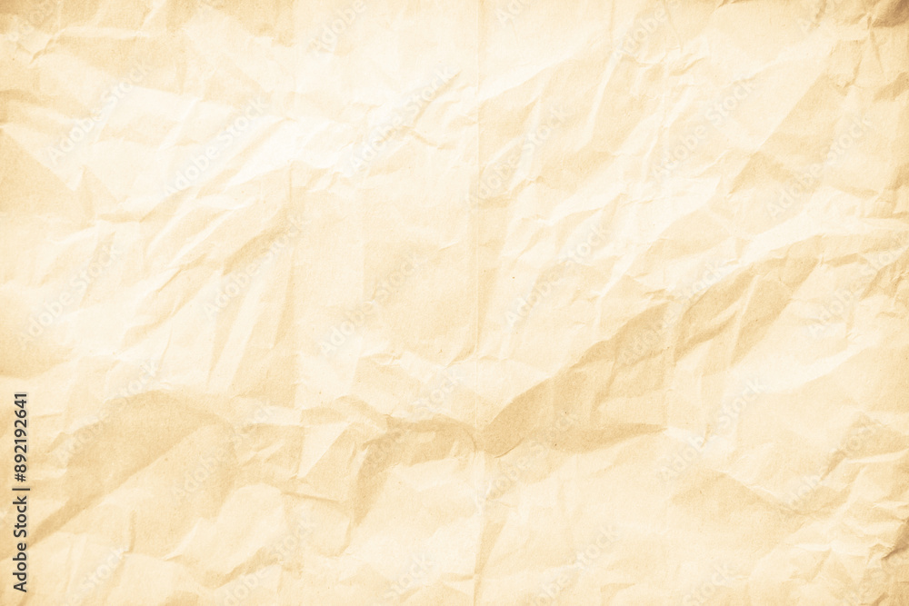 Obraz premium Crumpled brown paper texture background for design with copy space for text or image.