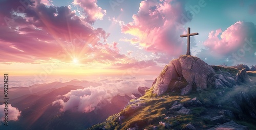 Cross on top of mountain at sunrise with a beautiful sky