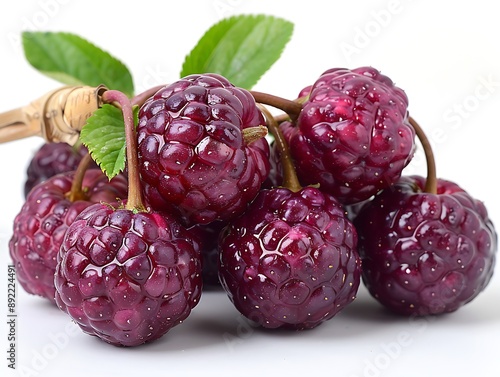 a bunch of raspberries with leaves. photo