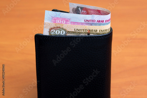 United Arab Emirates dirham in the black wallet photo