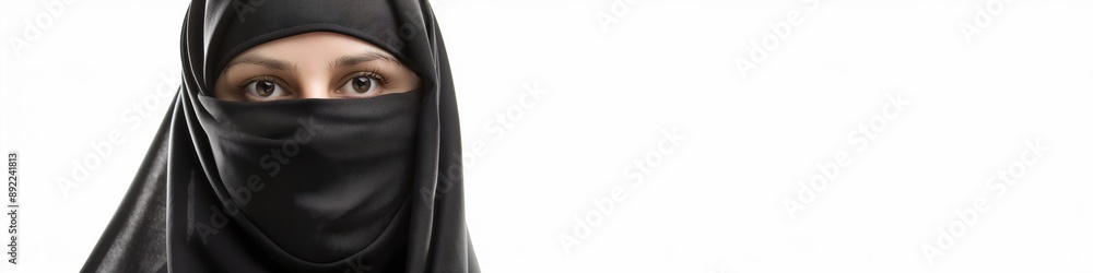 A young lady in a niqab, with expressive eyes, reflecting beauty and tradition in her attire. A young lady in a niqab, with expressive eyes, reflecting beauty and tradition in her attire.