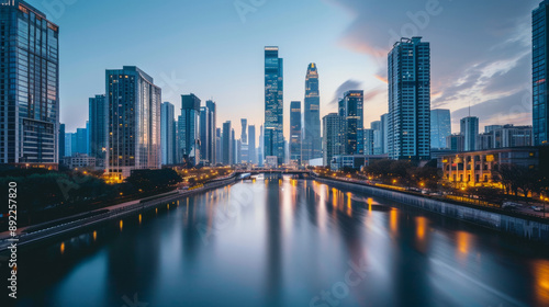 A modern cityscape with skyscrapers and a river running through the middle.