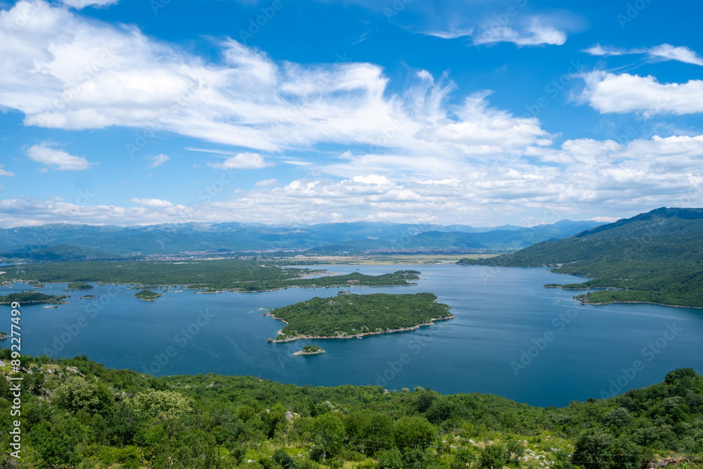 Great view of a lake, a few island and a mountains Great view of a lake, a few island and a mountains