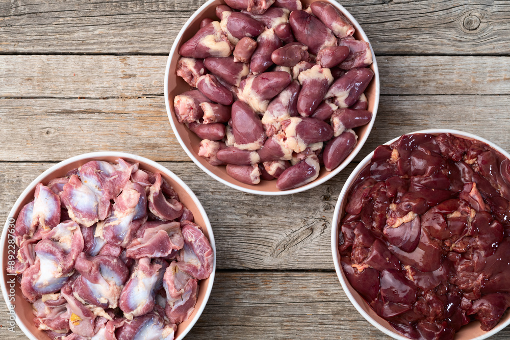 Raw chicken giblets raw poultry meat set : liver, stomach and heart Raw chicken giblets raw poultry meat set : liver, stomach and heart
