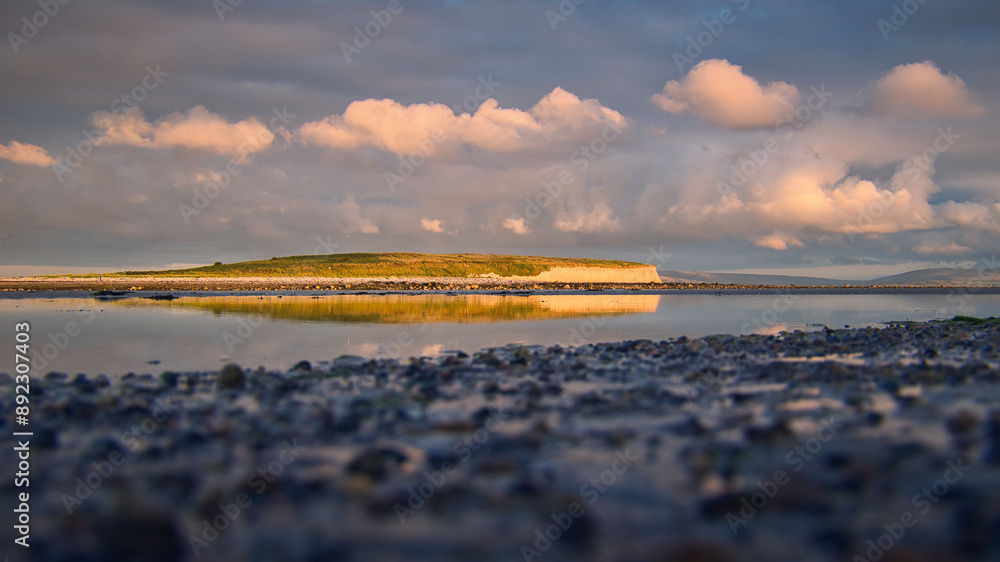 Dramatic coastal sunset landscape scenery with cliffs in background, sandy Silverstrand beach, Galway, Ireland, nature wallpaper