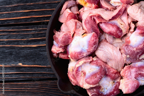 Raw chicken giblets gizzard ( stomach ) , meat background