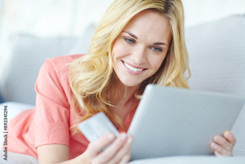 Tablet, credit card and smile of woman, browsing and happy with discount, sale and online shopping. Ecommerce, customer and joy of purchase of digital product, relax and mobile app in lounge of house Tablet, credit card and smile of woman, browsing and happy with discount, sale and online shopping. Ecommerce, customer and joy of purchase of digital product, relax and mobile app in lounge of house