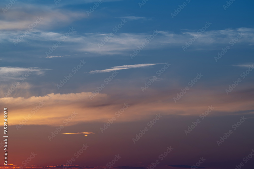 Fototapeta premium evening sky with clouds and rays of the sun, background