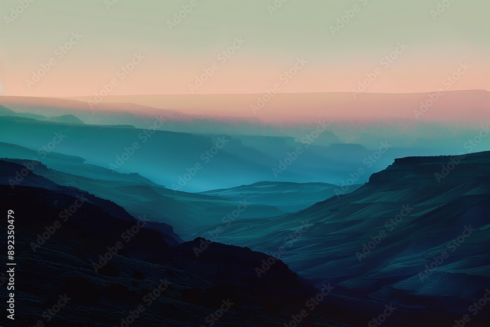 A misty mountain range silhouetted against a soft pink and blue sky at sunrise. A misty mountain range silhouetted against a soft pink and blue sky at sunrise.