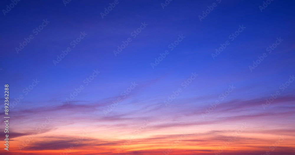 Fototapeta premium Colorful twilight sky background with streak clouds on beautiful dusk sky after sundown