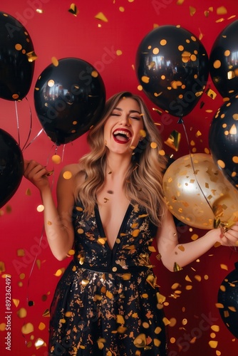 Excited Young Woman Celebrating with Balloons and Confetti