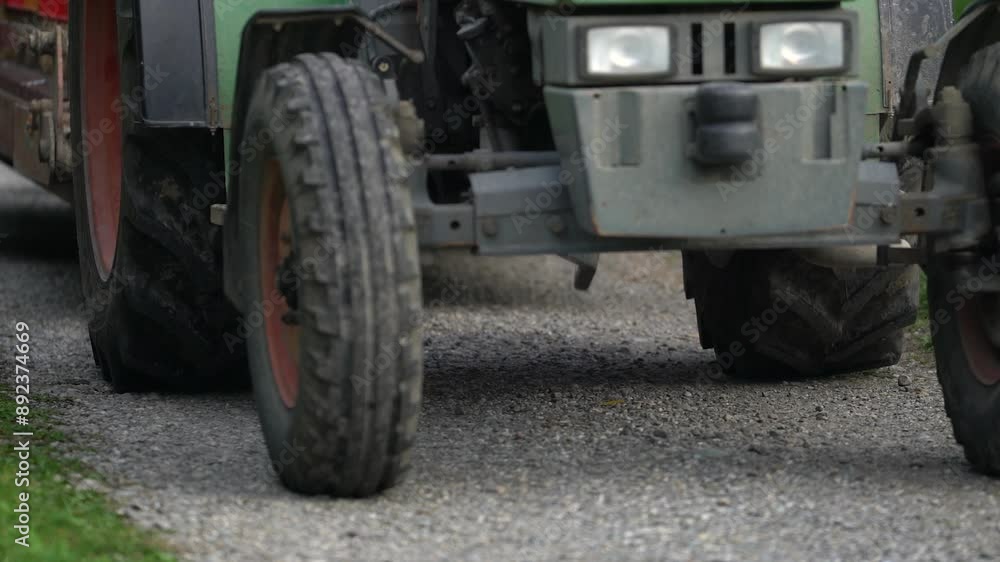 Tractor Tires Rolling on Gravel Road Tractor Tires Rolling on Gravel Road