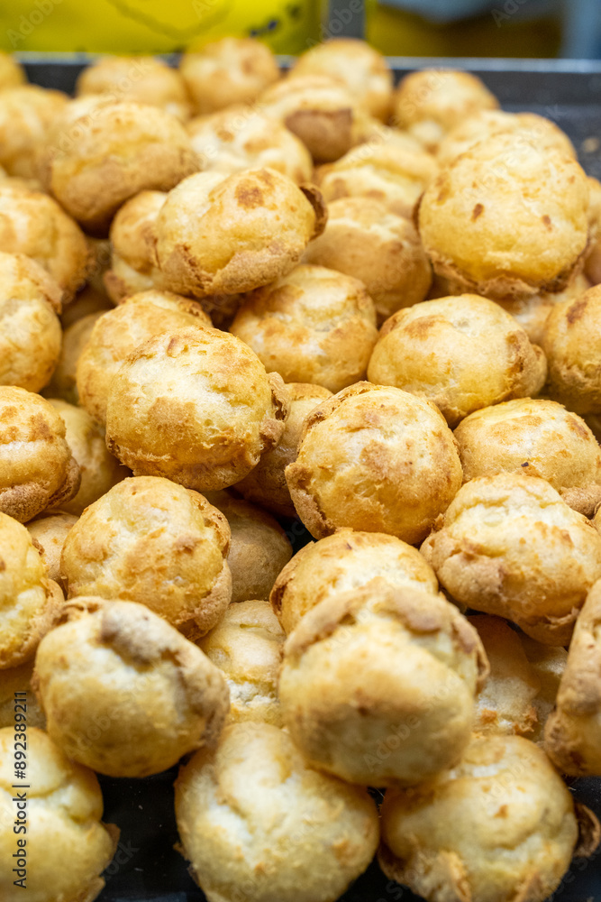 Delicious handmade puffs of the day are displayed on the counter Delicious handmade puffs of the day are displayed on the counter