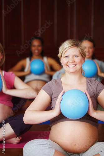 Woman, pregnant and yoga class for health, wellness and breathing with stomach, portrait and smile. Motherhood, face and happiness in studio for fitness, maternity and body awareness or prenatal care