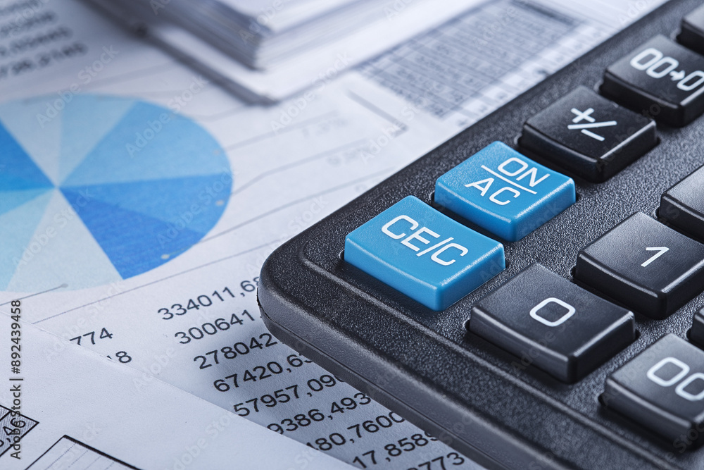 calculator and financial charts. Investment and capital accumulation concept calculator and financial charts. Investment and capital accumulation concept