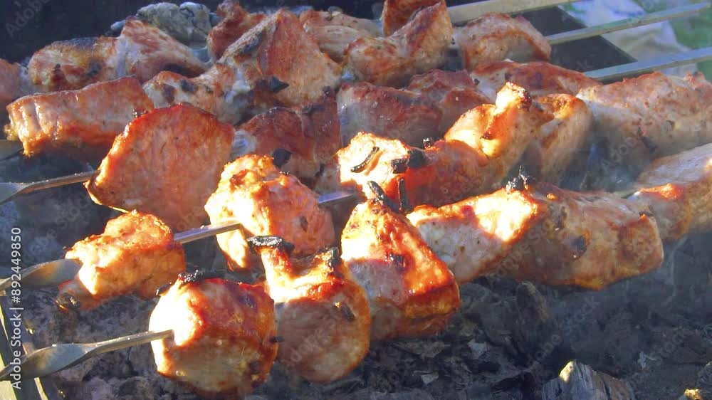 Cooking marinated shashlik. Chicken skewers grilled on bbq. Grilling meat on skewers on charcoal. Charcoal-grilled meat Cooking marinated shashlik. Chicken skewers grilled on bbq. Grilling meat on skewers on charcoal. Charcoal-grilled meat
