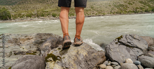 person walking on the beach of river 