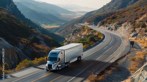 Semi-truck on the road with mountains in the background