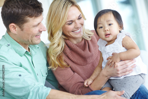 Fotografie Happy family, parents and portrait of foster baby child in home for care, support and bonding together