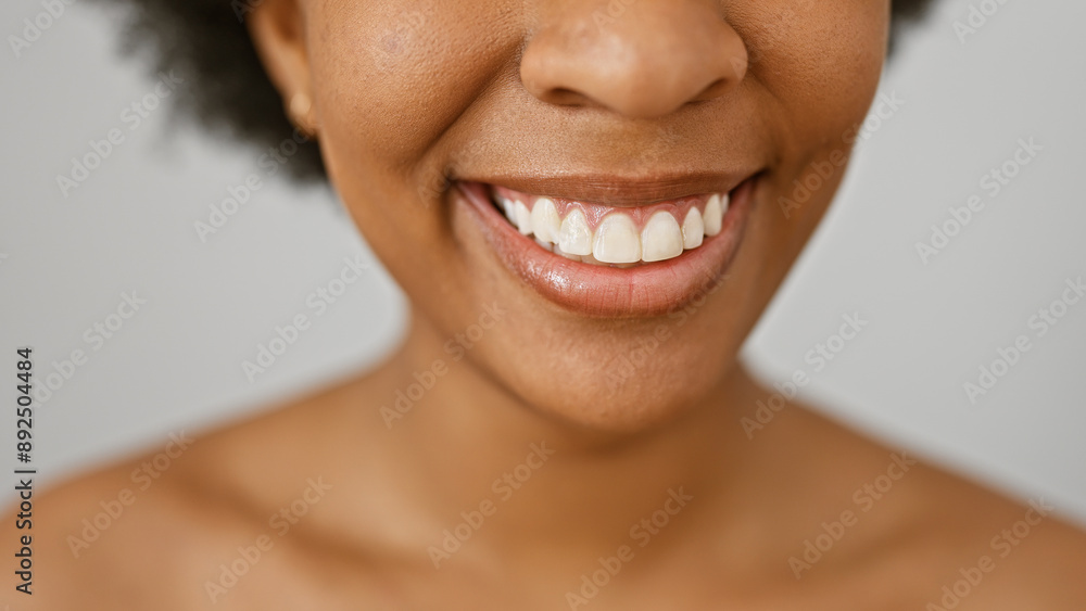 Close-up portrait of a smiling african american woman against a white background, depicting beauty and positivity. Close-up portrait of a smiling african american woman against a white background, depicting beauty and positivity.