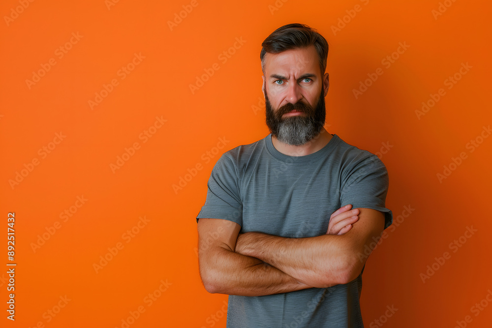 Mature Man with Beard in Studio with Serious Expression Mature Man with Beard in Studio with Serious Expression