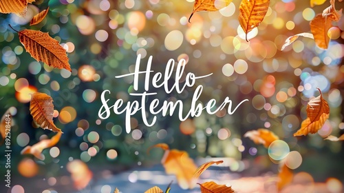 autumn leaves background, text “Hello September” on blurred background 