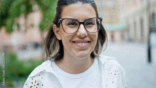 Photography Beautiful young hispanic woman smiling confident in the streets of Stockholm