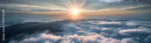 Stunning sunrise over fluffy clouds, with soft morning light illuminating the horizon. A breathtaking view of nature's beauty from above. © Chanoknan