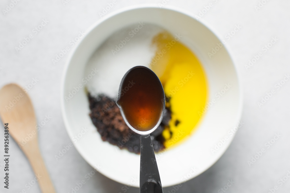 overhead view of Teaspoon of pure vanilla extract overhead view of Teaspoon of pure vanilla extract