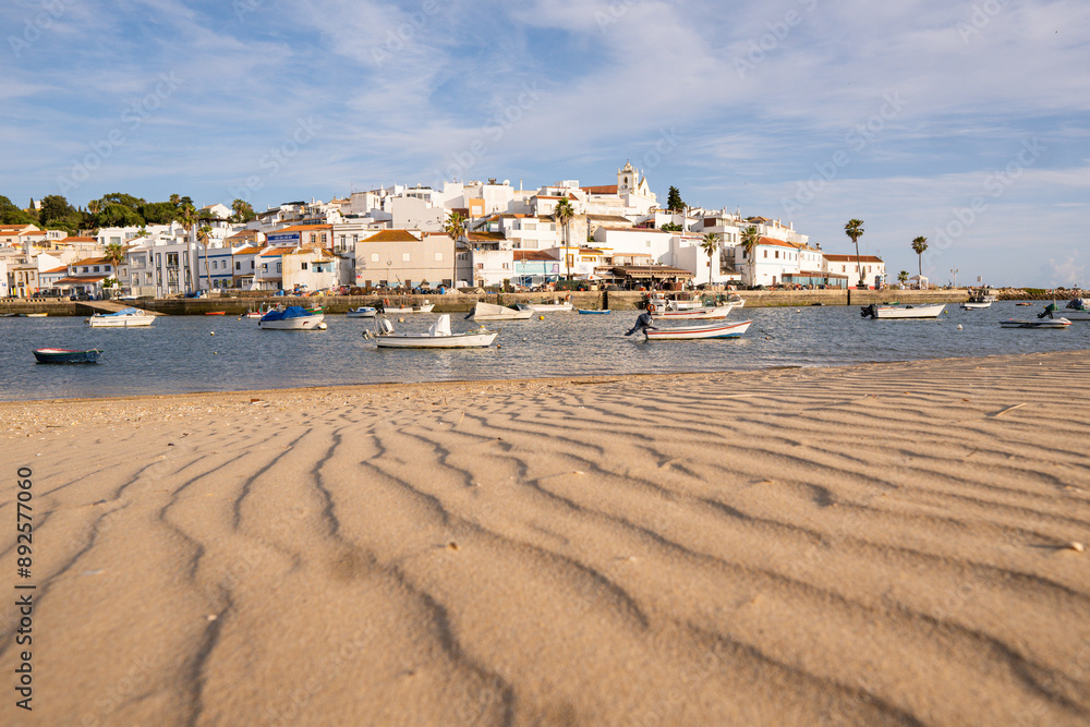 Old fisherman Ferragudo village with sandy beach on the foreground, Algarve, Portugal