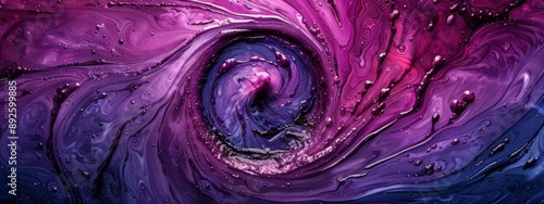  A tight shot of a purple-blue swirl with water drops at its base