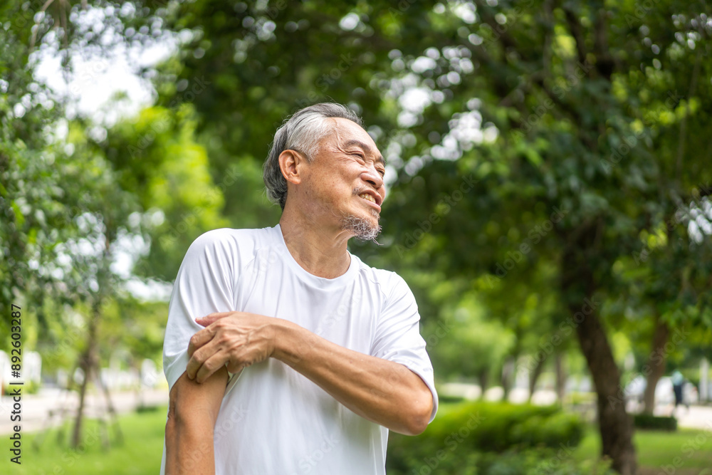 Senior asian man experiencing itchiness on his arm, scratching his upper arm with a concerned expression, skin irritation and itchiness in older adults, senior health, skin care and medical attention Senior asian man experiencing itchiness on his arm, scratching his upper arm with a concerned expression, skin irritation and itchiness in older adults, senior health, skin care and medical attention