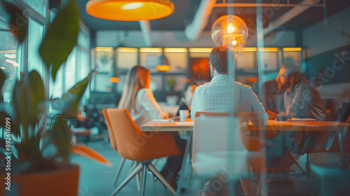 Business open modern office daytime daylight with blurred people in smart casual wear having a meeting. Working culture chill happy enjoy workplace work life balance plant women men employee