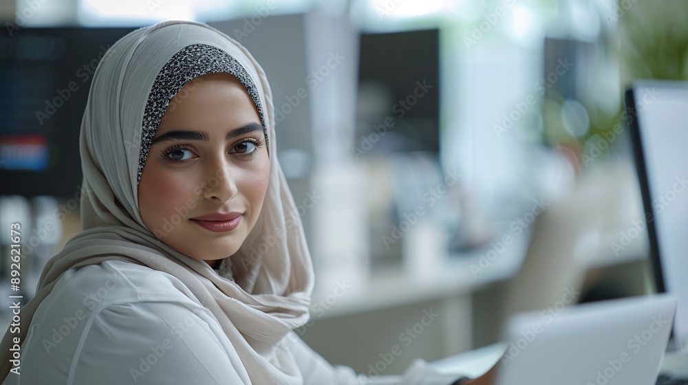 Ultra-wide angle shot of a Hijab girl working on office desk. Ultra-wide angle shot of a Hijab girl working on office desk.