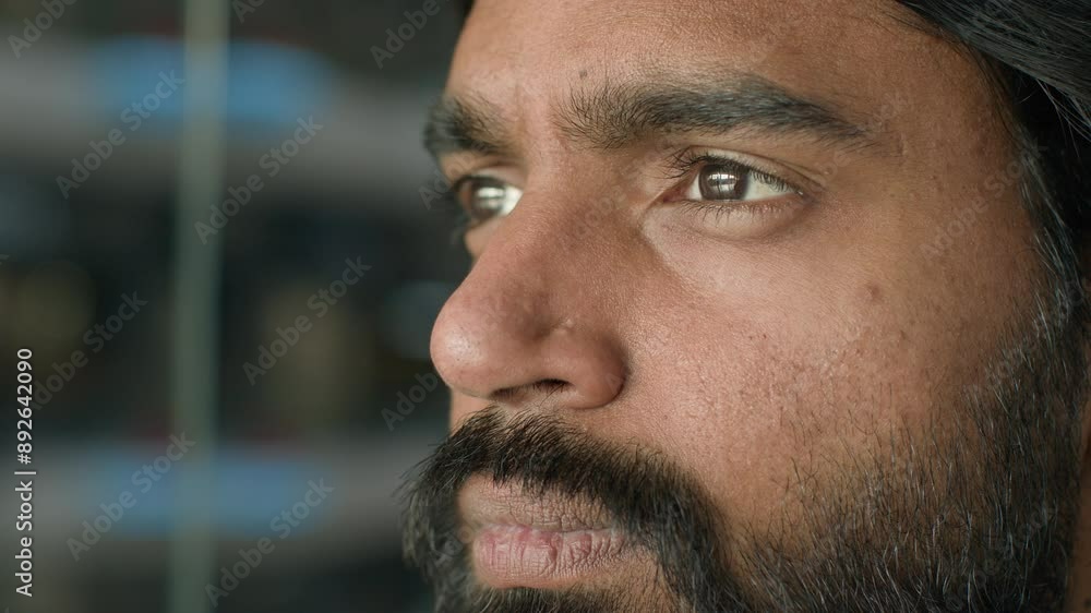 Close-up pensive serious puzzled thoughtful bearded indian man face businessman ethnic arabian guy thinking idea think business problem ponder question dreaming search difficult solution male portrait Close-up pensive serious puzzled thoughtful bearded indian man face businessman ethnic arabian guy thinking idea think business problem ponder question dreaming search difficult solution male portrait