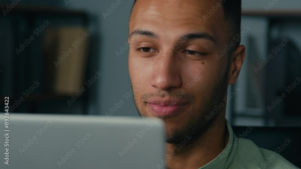 Close-up african american man male businessman manager talking on video call in office guy talk web chat using laptop computer speaking at online conference distant interview remote negotiating client Close-up african american man male businessman manager talking on video call in office guy talk web chat using laptop computer speaking at online conference distant interview remote negotiating client