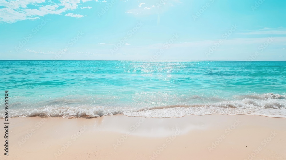 Obraz premium Sunny beach with turquoise water and clear sky, perfect for summer vacation ads
