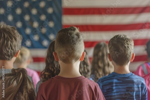 Children Standing Before a Large American Flag in a Classroom