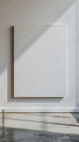 Blank canvas on textured wall in sunlit room