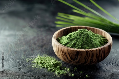 Revitalize your body with nutrient-dense wheatgrass or barley grass powder in rustic bowl on dark background photo