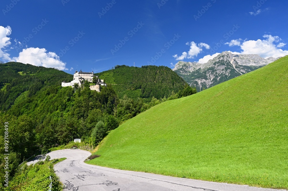 A landscape with nature and a beautiful old castle. Hohenwerfen medieval castle towering over the Austrian town of Werfen. A landscape with nature and a beautiful old castle. Hohenwerfen medieval castle towering over the Austrian town of Werfen.
