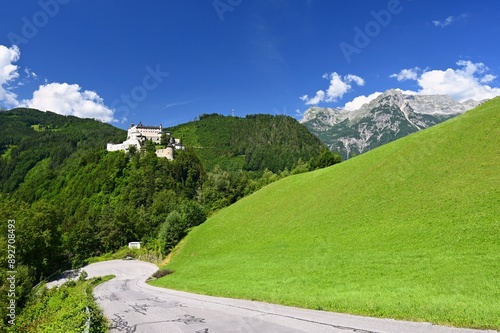 A landscape with nature and a beautiful old castle. Hohenwerfen medieval castle towering over the Austrian town of Werfen.